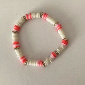 Pink and white clay bead bracelet with disks